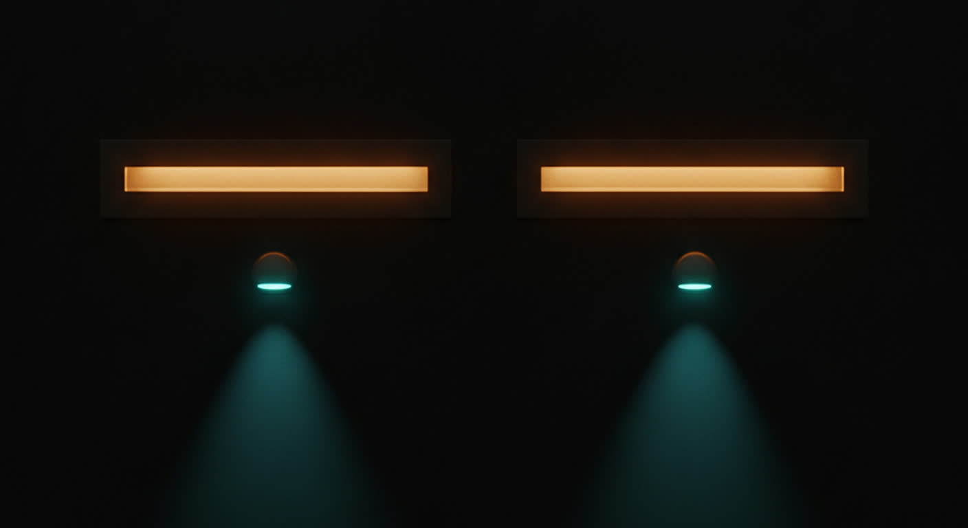Two separate amber mail slots side by side in a dark wall, each with its own teal light