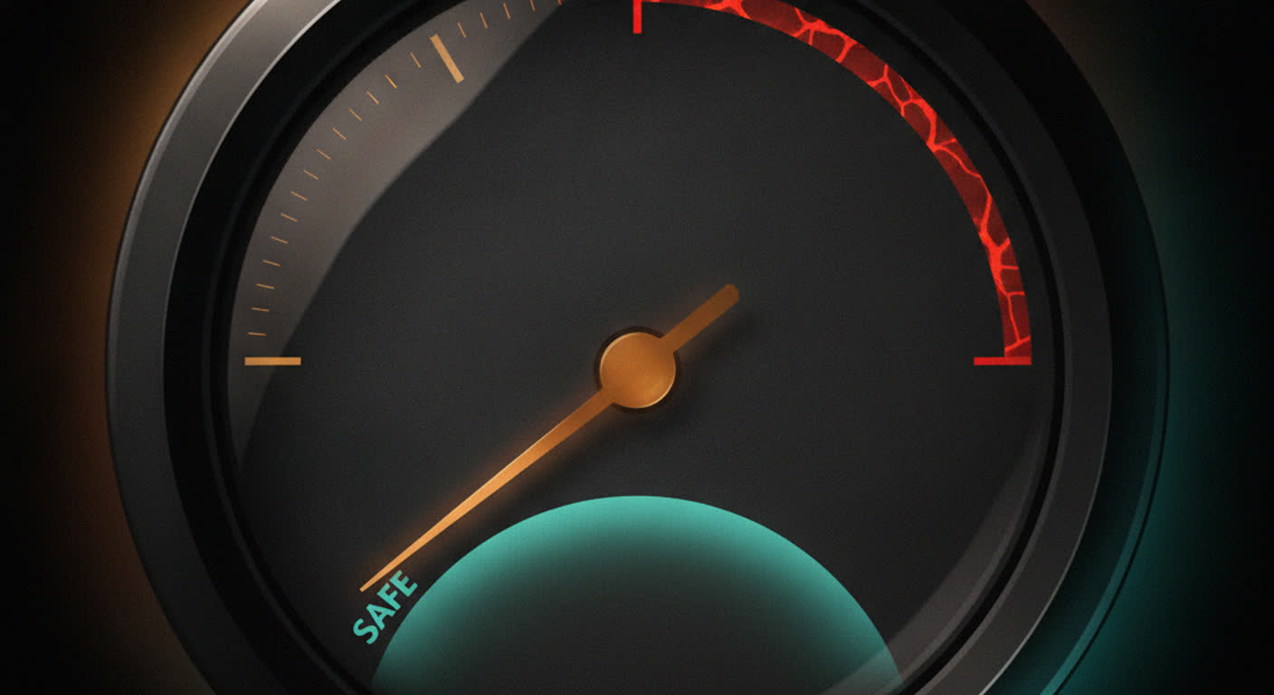 A dark gauge with an amber needle in the safe low zone and an untouched red danger arc